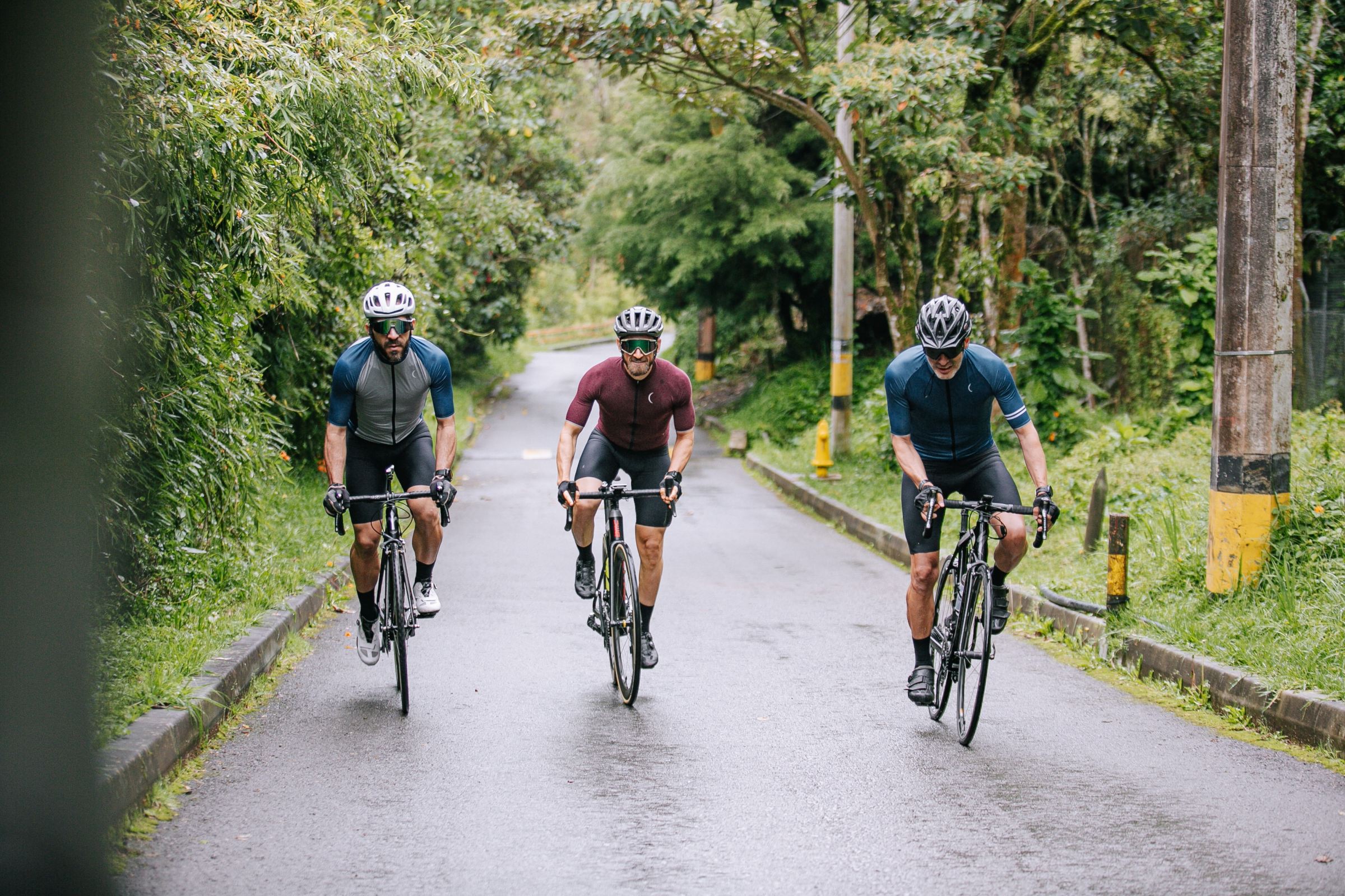 a group of people riding on the back of a bicycle